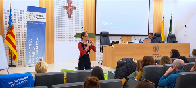 Image of Mache talking in the conference