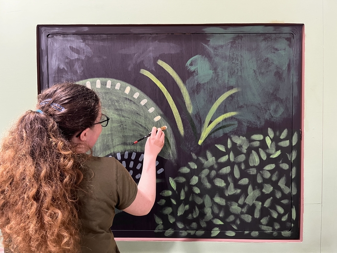 student working on Miss Prydderch set painting