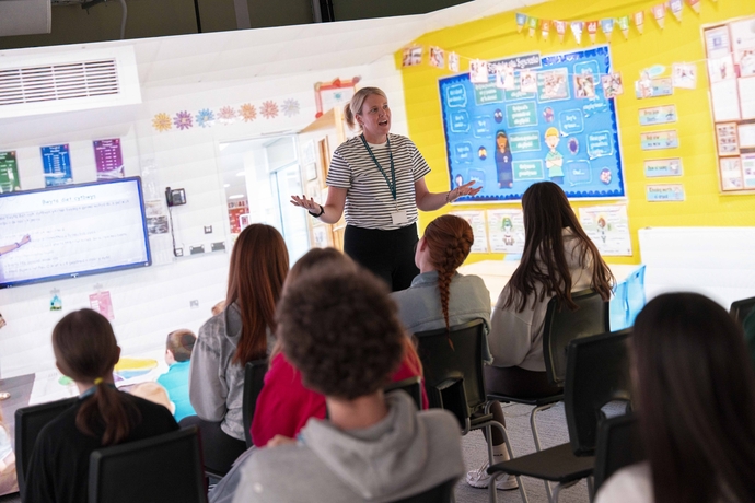 students in a lecture in our immersive rooms