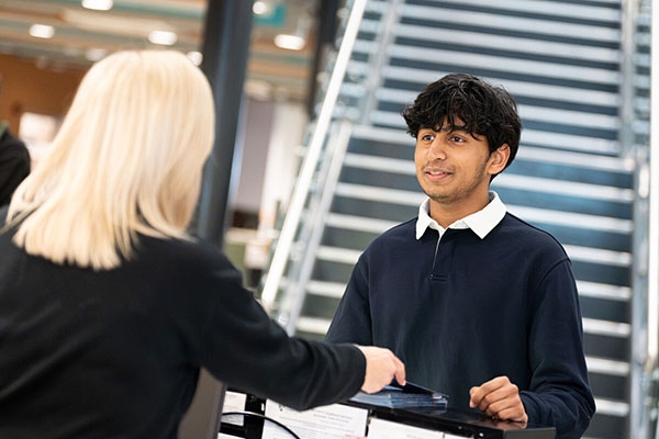 Student looking at other student