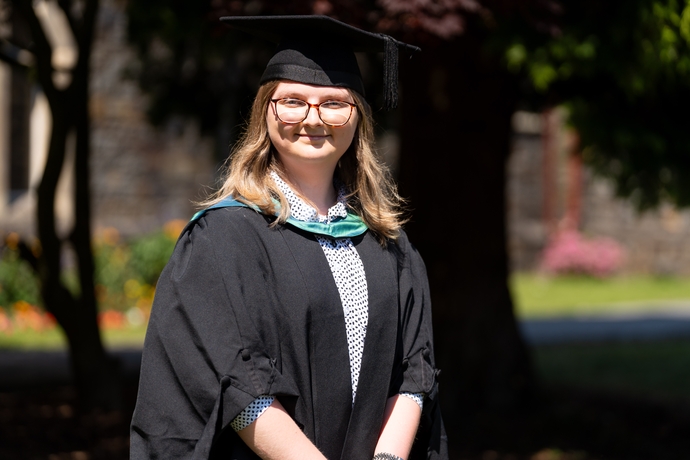 Image of Kimberley Skeels in her cap and gown 