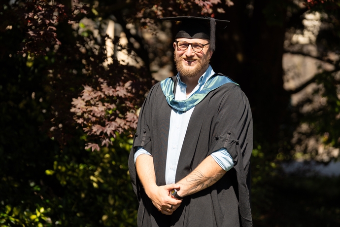 an image of Dan in his cap and gown 