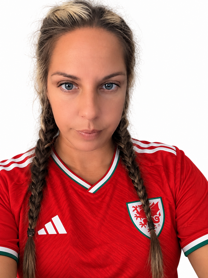 Headshot of Sarah Stanley wearing Wales football top