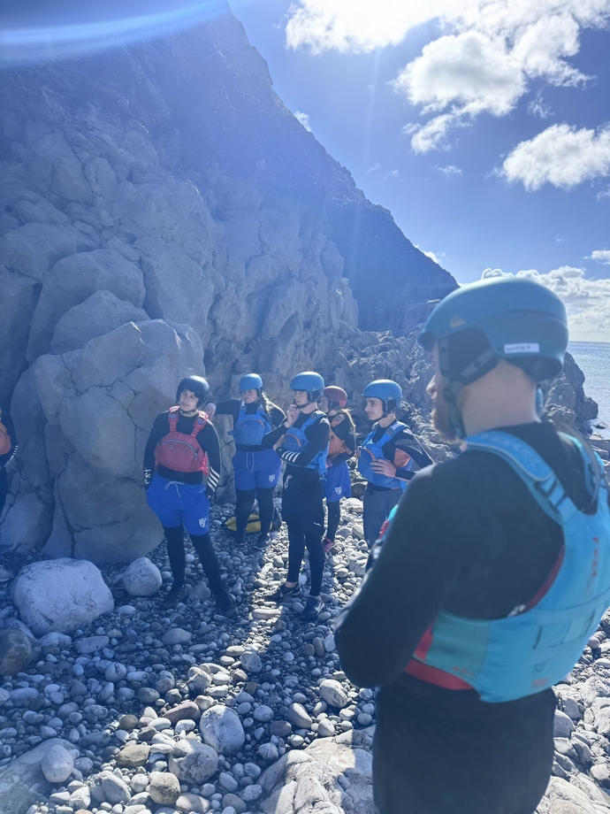 Pupils on beach ready to take part in coasteering