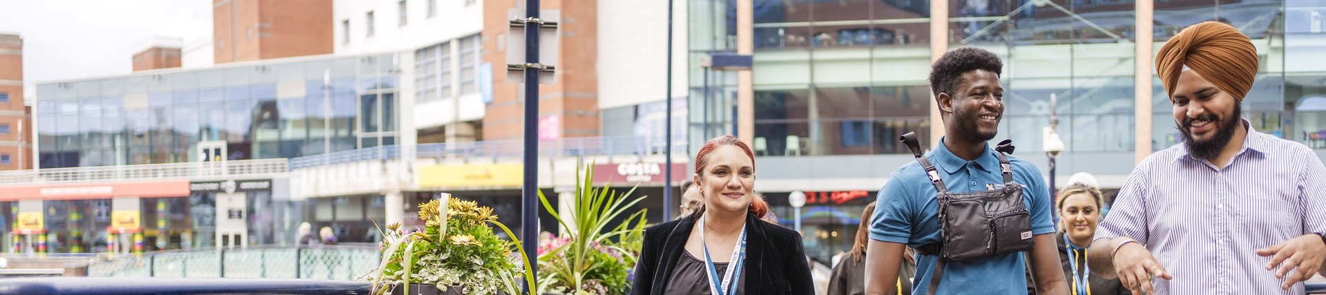 Students crossing bridge in Birmingham city centre