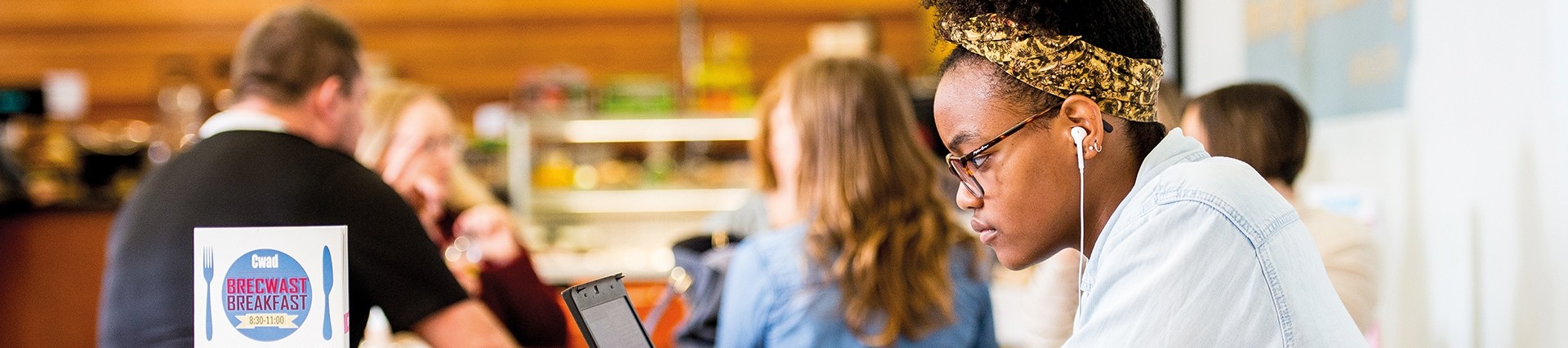 Student sitting looking at laptop