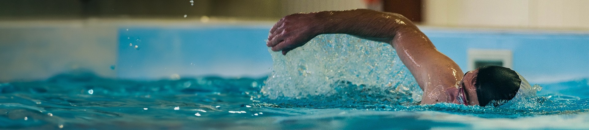 Person swimming in a pool