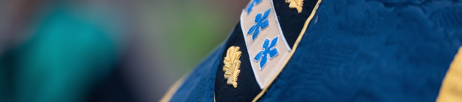 UWTSD badge on the back of a robe