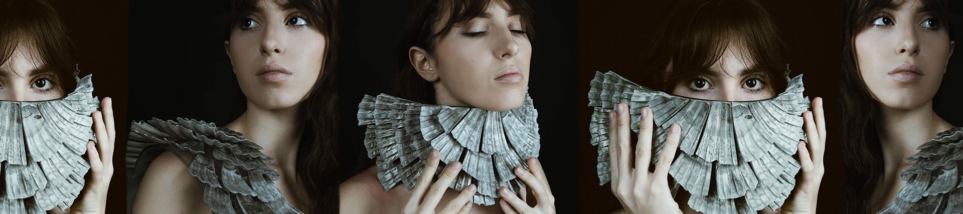 Five images of a young woman against a single black background; she holds a crescent of layered shells in different positions over her shoulder and face.