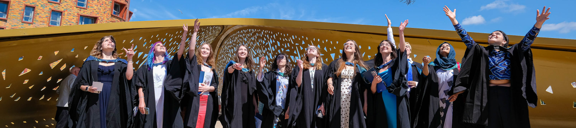 Students throwing mortar boards in Swansea