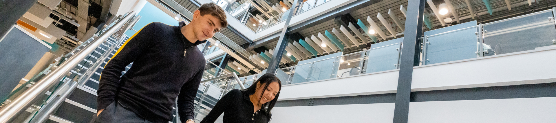 Students walking down stairs in IQ