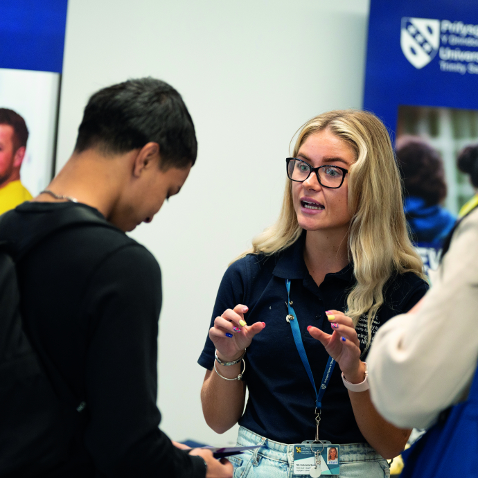 Staff member interacting with a potential student