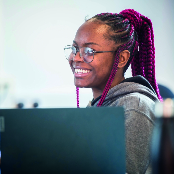 Girl smiling over laptop