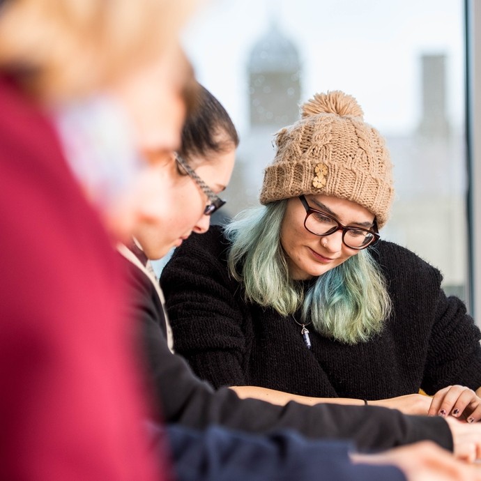 Students collaborating at a desk