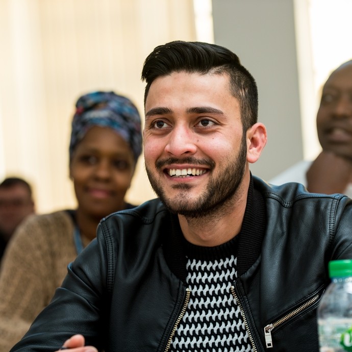 Student smiling in a classroom