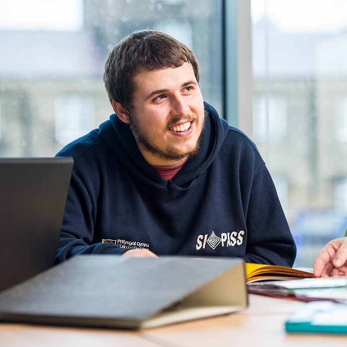 Student smiling and facing to the right