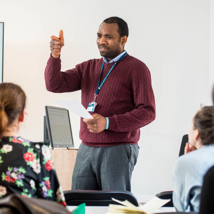 Staff member presenting to a class