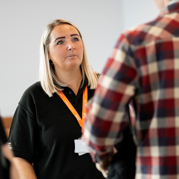 Staff member assisting a student