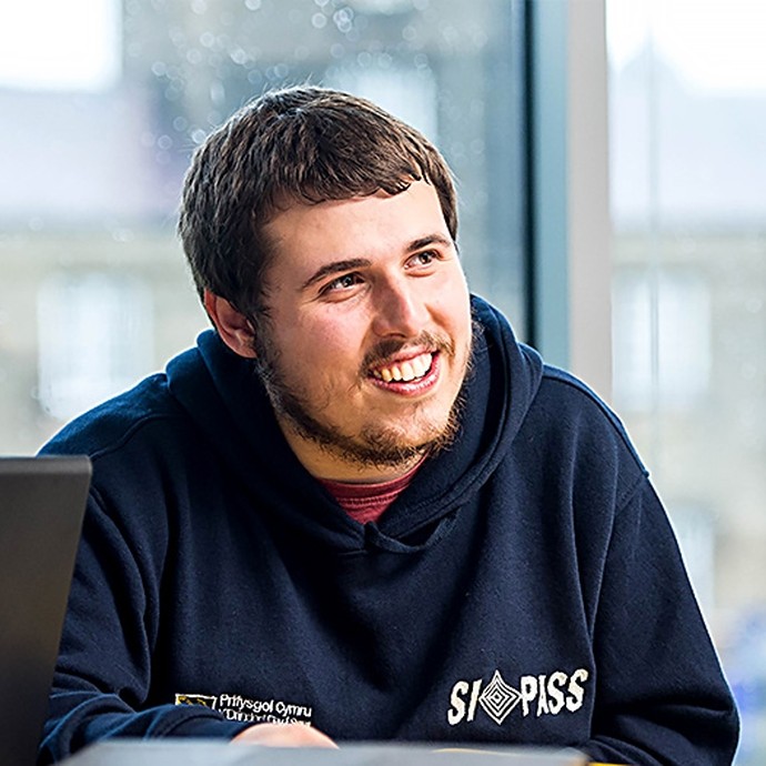 Student smiling and facing to the right