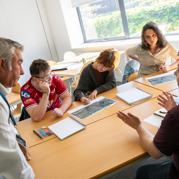 Image of students working on class project