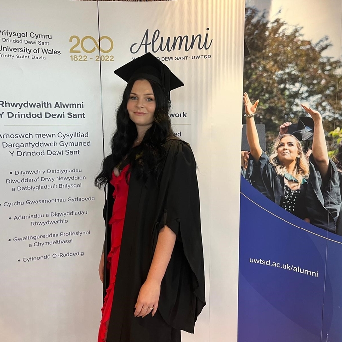 photo of student in cap and gown 