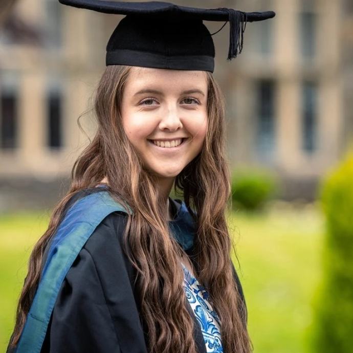 Picture from graduation of Cerys Bailey wearing cap and gown