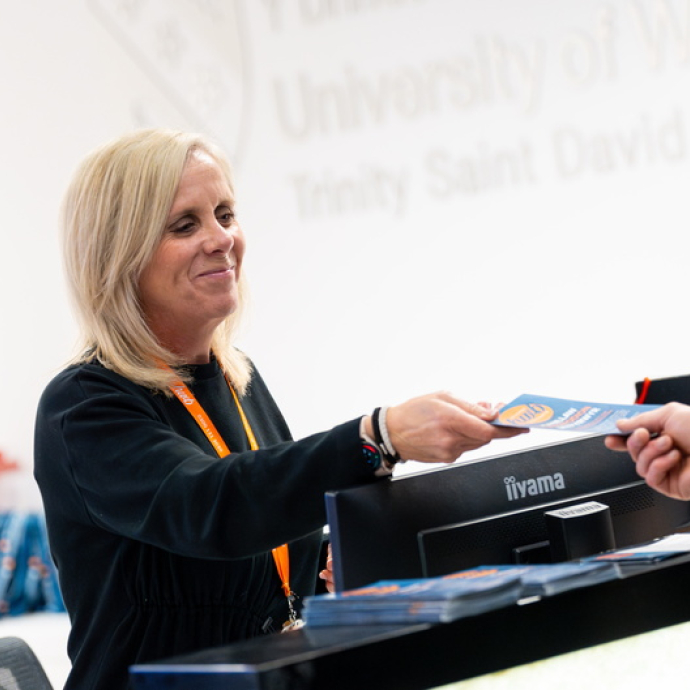 hwb staff member supporting students