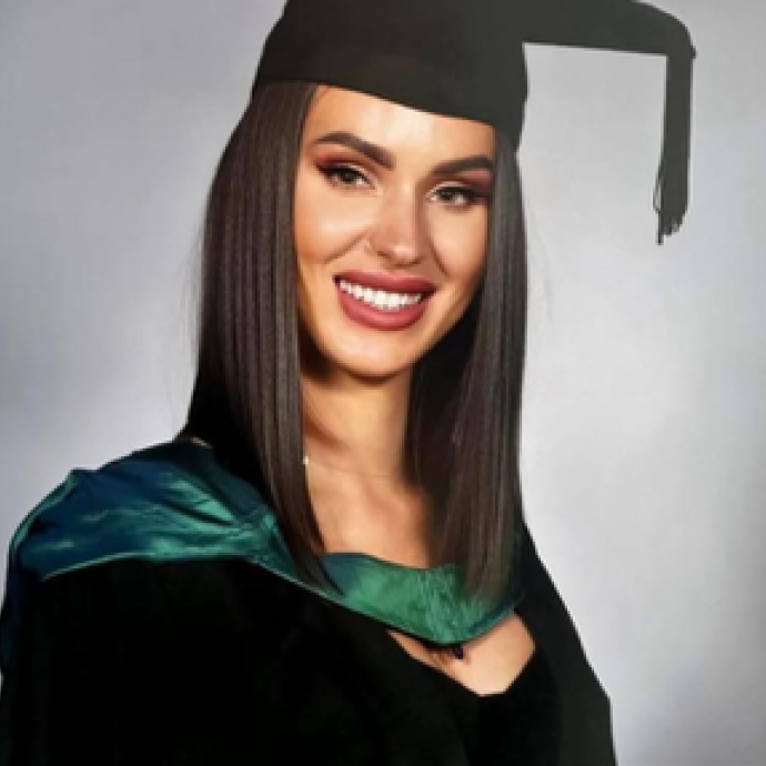 Image of woman in graduation cap and gown