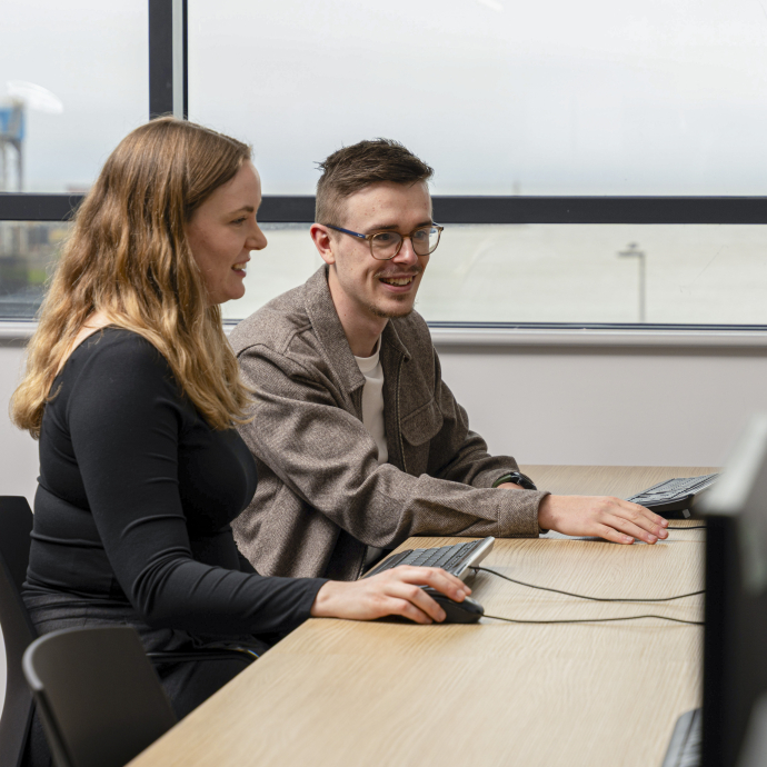 Two students at a computer