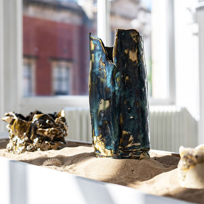 art and design of a teal glass sculpture