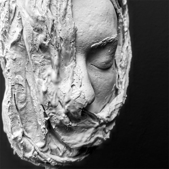 Clay face with smudging one side