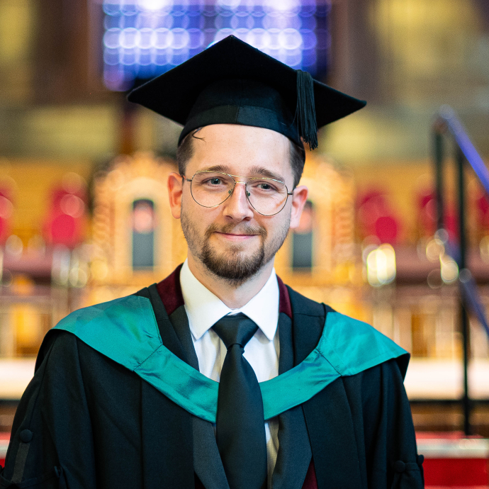 an image of Lewis in his cap and gown