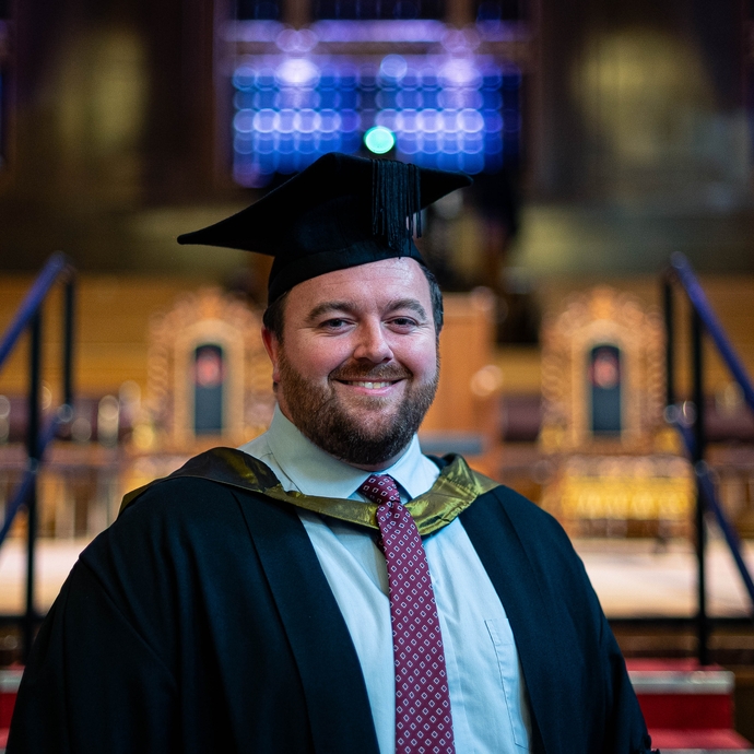 image of Matthew Rees in his cap and gown 