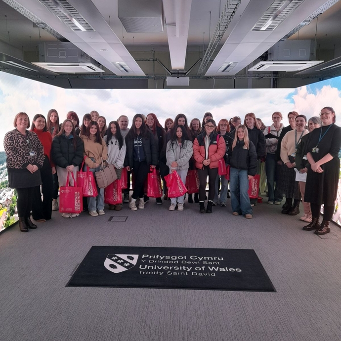 Coleg Ceredigion Trip to UWTSD group shot in the immersive room 