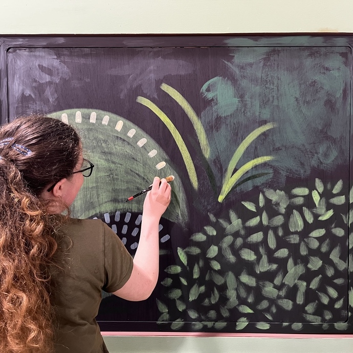 student working on Miss Prydderch set painting