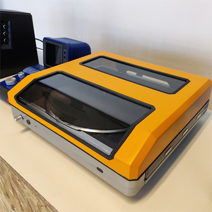 A yellow and black computer with a sleek design, showcasing its modern features and vibrant color scheme.