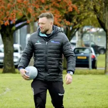 Dan Ley with a football